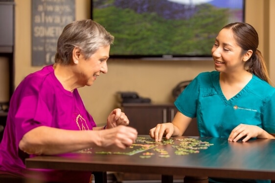 Nurse and Elderly Lady Playing